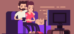 Mark Roemer image of two people sitting on a couch watching television with a cat