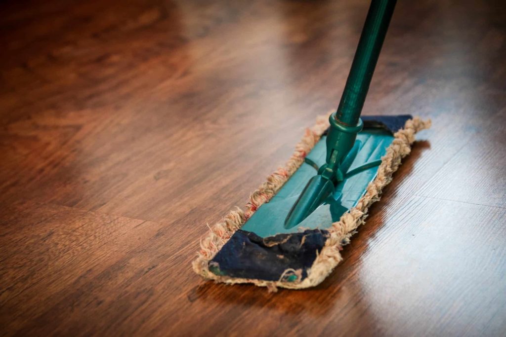 Mark Roemer image of a duster mop on a hard wood floor