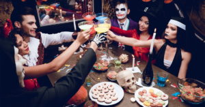 Mark Roemer image of a small group of people having a Halloween party