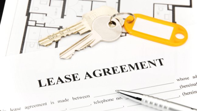 Mark Roemer image of a lease agreement , pen, and keys