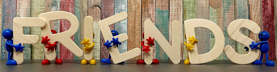 Mark Roemer image of wooden letters spelling out friends with small meeples