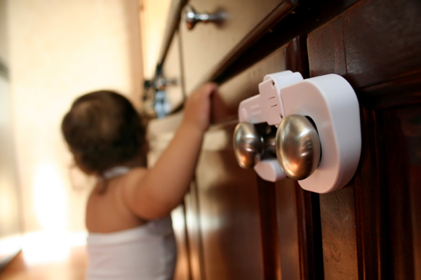 Mark Roemer image of a child safety lock on a cabinet door