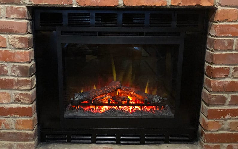 Mark Roemer image of an electric fireplace instert.