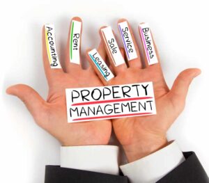A person's hands with the essentials of property management written on tape on each finger. The items include: business, service, sale, leasing, rent, and accounting.